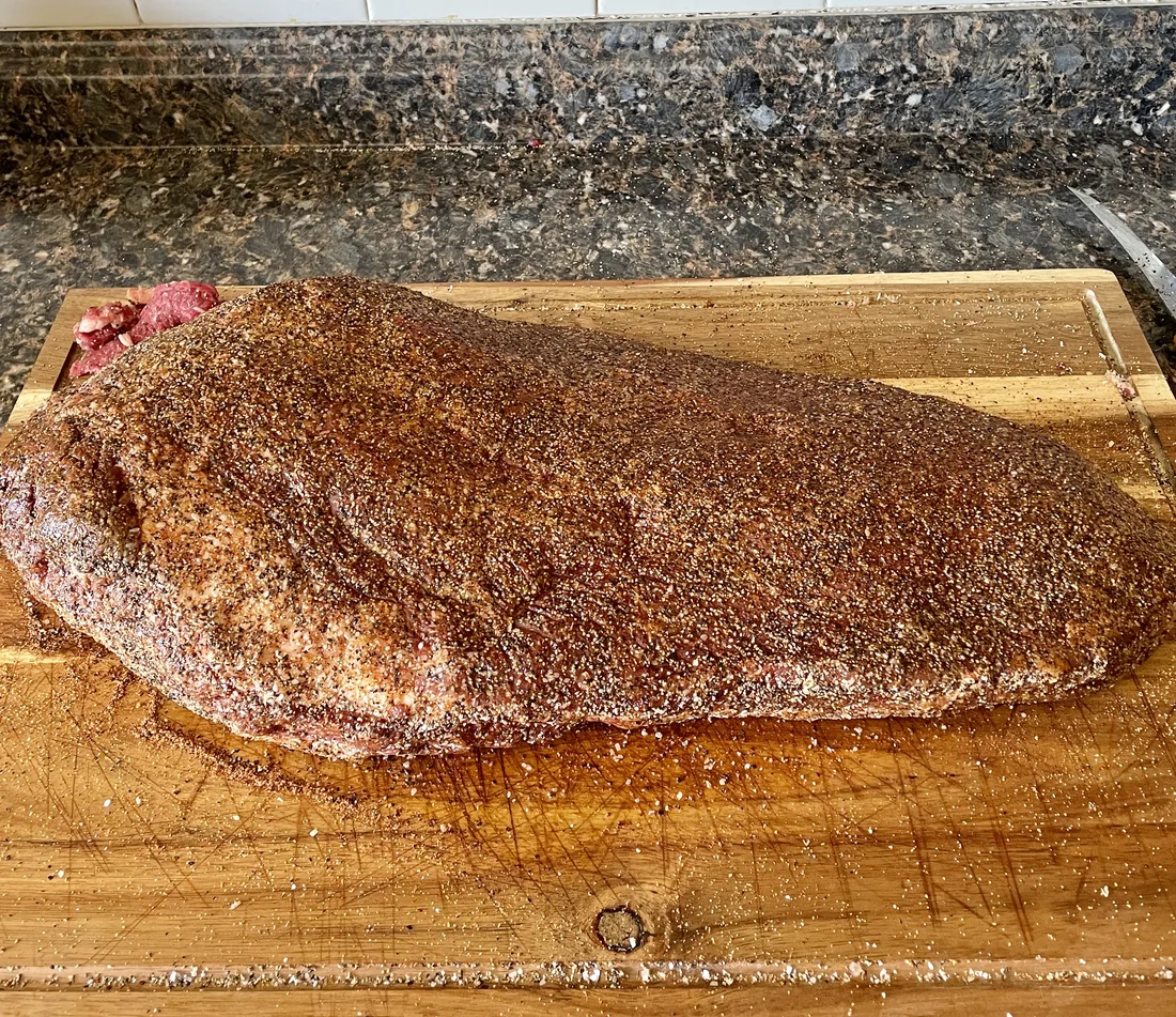 A brisket prepared with rub before smoking