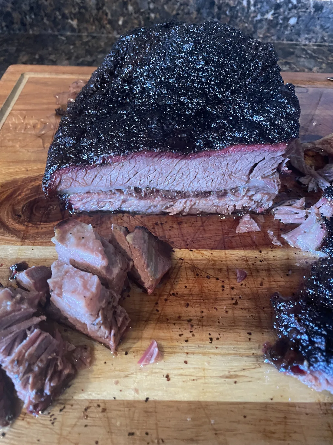 Sliced smoked brisket on a cutting board